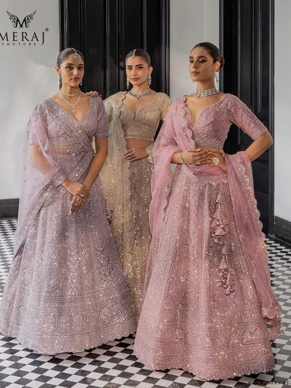A symphony of shimmer, grace, and grandeur. This image showcases bridal lehengas in soft pastels and regal golds from my 'Ruvaah' collection.