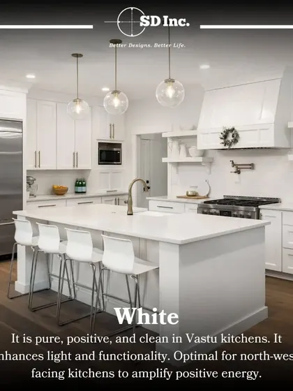 According to Vastu, white is a perfect color for kitchens as it enhances light and positive energy. This all-white kitchen with an island is a beautiful example of a clean, pure, and functional design.