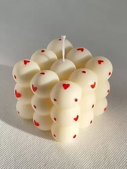 A special Galentine's Day order. This bubble candle with tiny red hearts is one of our favorite custom designs.