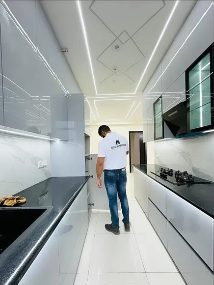 Inspecting the soft-close mechanism of the kitchen drawers. We use high-quality hardware to ensure durability and a smooth, silent user experience in all our modular kitchens.