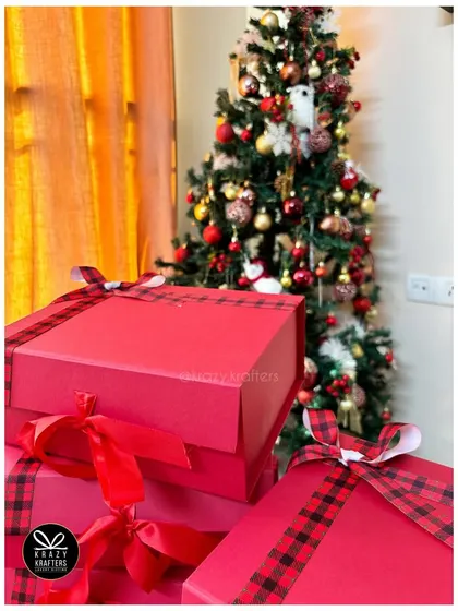 Getting into the holiday spirit with our festive red Christmas gift boxes.