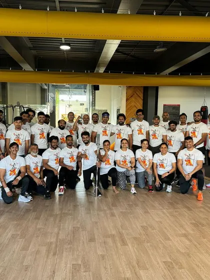 Our team and members coming together for a themed workout, celebrating with custom t-shirts and a strong sense of community.