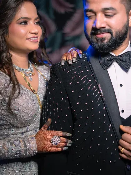 A beautiful portrait of the couple. The bride's makeup is elegant and sophisticated, a perfect match for her glamorous attire.