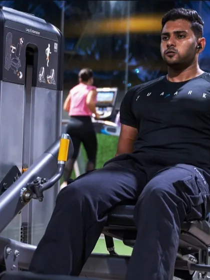 Another angle of a focused leg curl session. Our gym provides a distraction-free environment, allowing you to connect with your workout and maximize every movement.