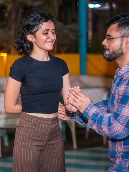 A gentle and focused moment between two dancers.