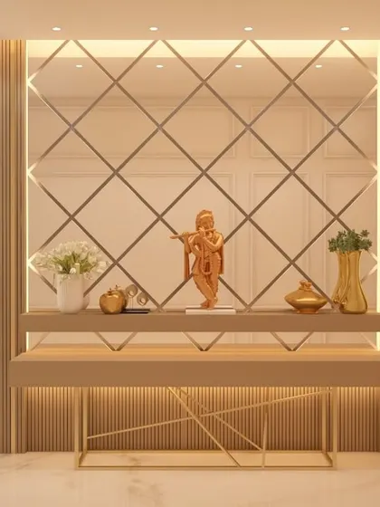 A beautifully crafted foyer console set against a diamond-patterned mirror wall that amplifies light and space. This entryway design makes a strong first impression, combining elegant materials with functional design elements like wall sconces and a sleek tabletop for decor.