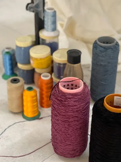 The tools of my trade for the embroidered Heritage Collection. Spools of colorful thread and pots of beads are the palette from which I "paint" these intricate tapestries.