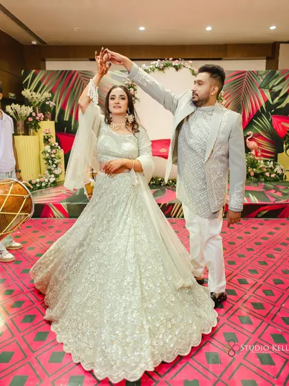 A shot of the couple dancing, the bride's lehenga twirling beautifully.