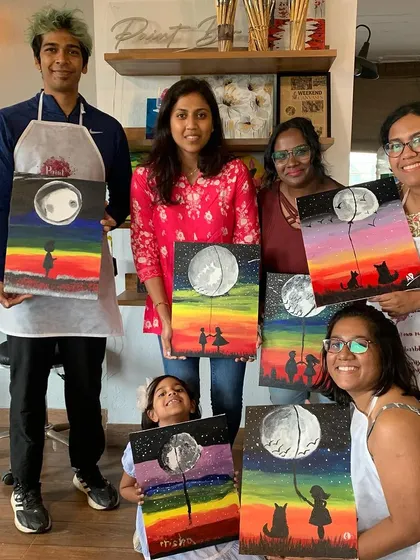 A group of happy painters at our studio, including a little one. Our workshops are open to all ages and skill levels.