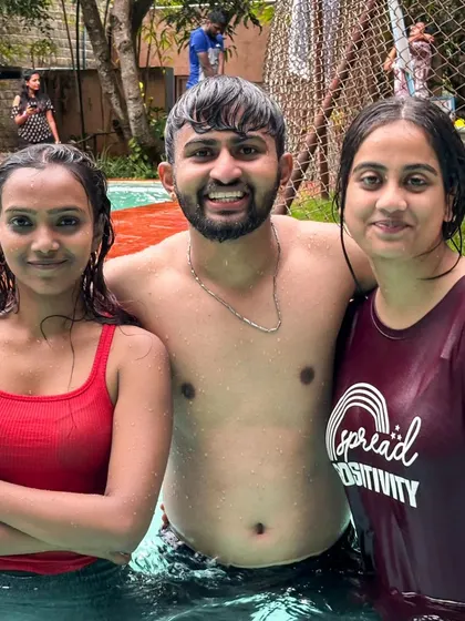 Posing with friends in the pool. It's all about having a good time together.