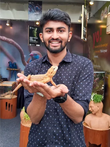 Holding a bearded dragon at Pet Fed. It was fascinating to get up close with these amazing creatures.