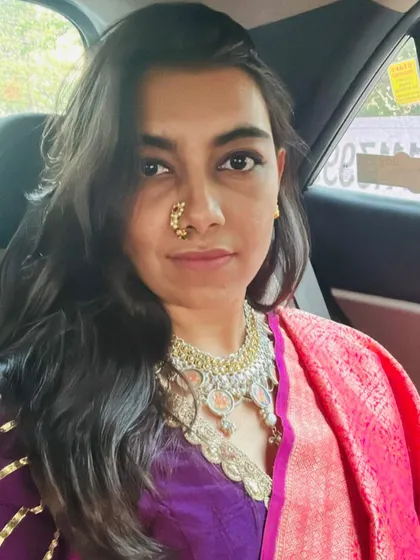 A vintage Maharani look, featuring a stunning 'Ganga Jamna' vintage silver necklace with hand-painted miniatures, paired with a classic Maharashtrian Nath.