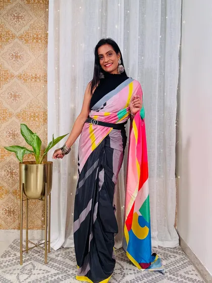 This multi-color abstract print pre-stitched saree from Myntra is so convenient and stylish. I've styled it with a belt for a modern, edgy look.