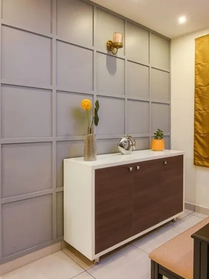 Another view of the console and accent wall, showing how it fits perfectly into a dining nook, providing both storage and style.