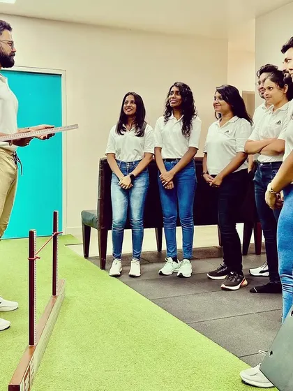 I am demonstrating a technique to my team. Sharing knowledge and expertise is key to our collective growth.