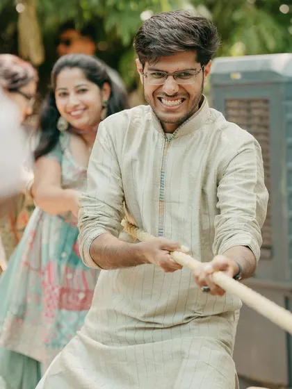 Guests engage in a lively game of tug-of-war, a perfect icebreaker and a source of much laughter.