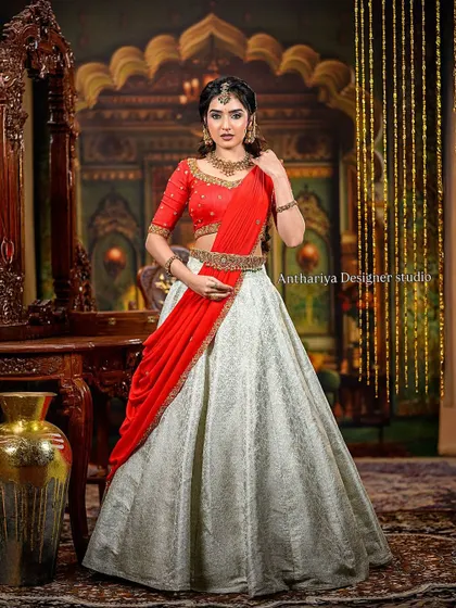 The full view of the red and off-white lehenga, a perfect blend of traditional colors and modern silhouette.
