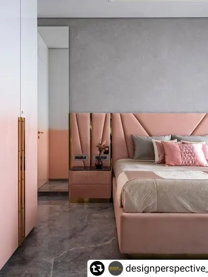 A view of the daughter's bedroom in the 'Fifty Two' apartment, where the pink ombre wardrobes and upholstered bed create a cohesive and stylish look.
