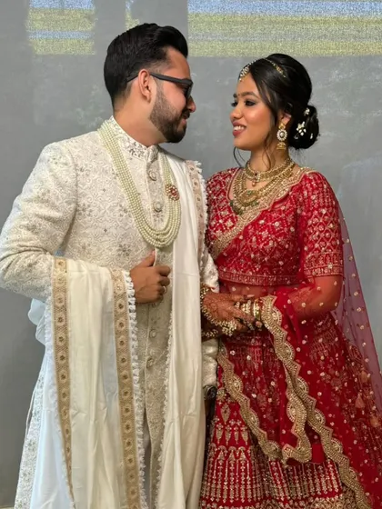 The happy couple. Riya's minimal makeup looks stunning next to her husband's classic sherwani. A timeless and elegant pair.