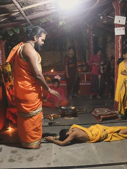 A student performs 'Sashtanga Namaskar', showing complete reverence to the Guru and the tradition. This act of surrender is a key part of ego dissolution and true learning in the Gurukul system.