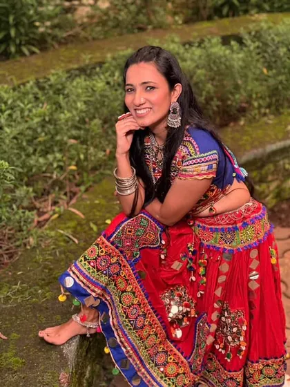 This traditional red Kutchi work ghagra is a showstopper for Navratri. The mirror work and colourful embroidery are stunning.