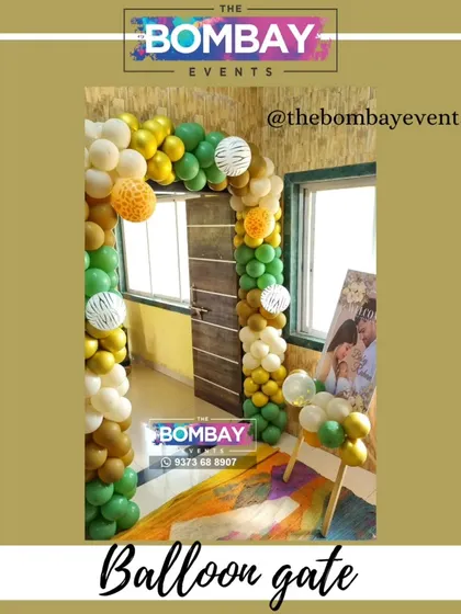 This jungle-themed balloon arch uses multiple shades of green, gold, and textured balloons. This type of organic balloon design is very modern and can be adapted to create an elegant entrance for a corporate gala or event.