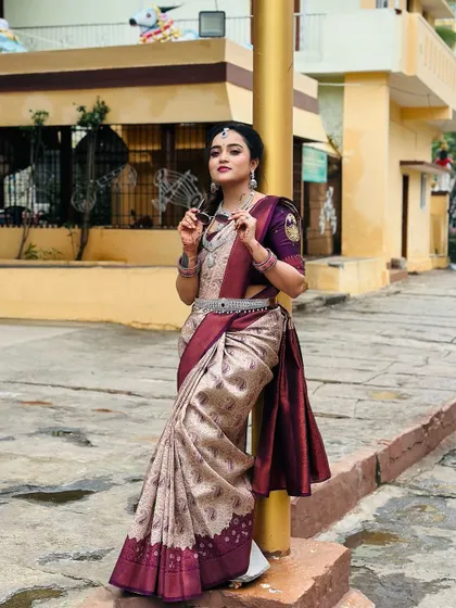 My silver-finish CZ jewellery set, including the vaddanam, complements this elegant saree perfectly, showcasing its versatility for traditional wear.