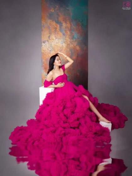 The reflection on the floor doubles the impact of this incredible pink ruffled gown. It’s a creative technique I use to add a touch of glamour and sophistication.