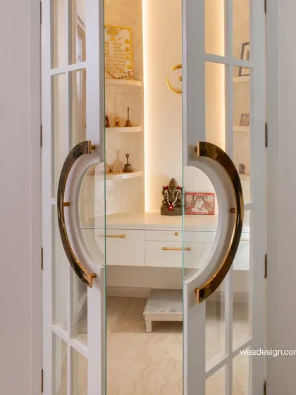 Duplicate of 95, showing the beautiful pooja unit that serves as a spiritual centerpiece in the home.