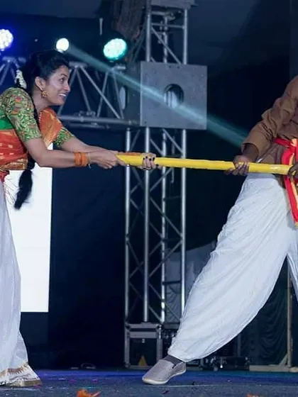 Incorporating traditional props and storytelling into a community performance. This piece was a playful depiction of rural life for the Kannada Rajyotsava show.