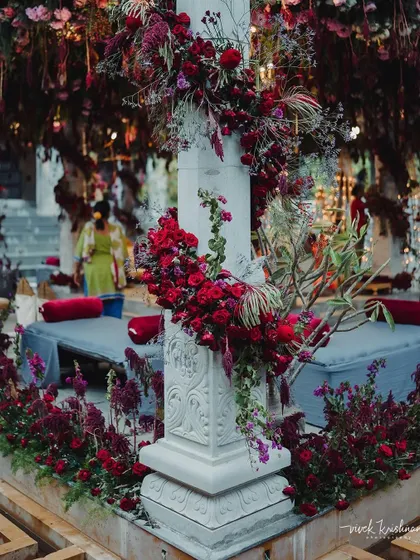 The art of floral design is in the details. This image shows the texture and depth we create by combining different types of red flowers and foliage for a rich, monochromatic look.
