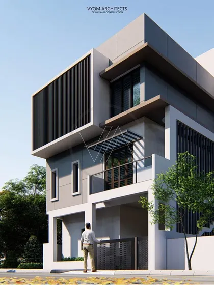 A renovation project in NRI Layout, Bangalore, where two floors were added to an existing structure. The design uses a play of solid and void, with a prominent framed screen, to create a minimalist contemporary look while managing structural loads.