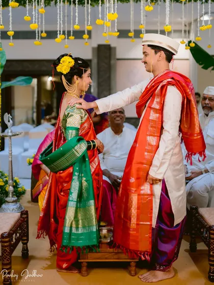 A candid moment during the wedding ceremony, filled with smiles and gentle gestures.