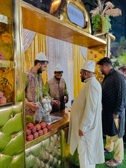 A close-up of a guest interacting with our staff at the Kawa counter.