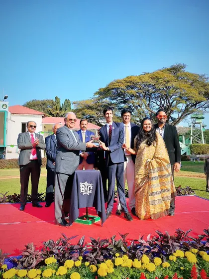 Mr. Chaduranga Kanthraj Urs presents The Narasimharaja Cup to the winning syndicate of El Rey.