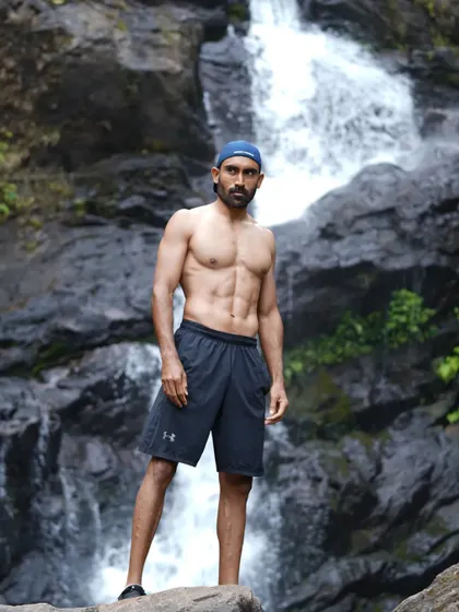 At work, surrounded by the beauty of Coorg's waterfalls. My lifestyle is about integrating my passion for fitness with my love for the outdoors.