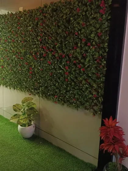 Another view of the green wall and turf floor combination in a commercial setting. This design brings a refreshing outdoor feel inside, making the space feel more open and natural.