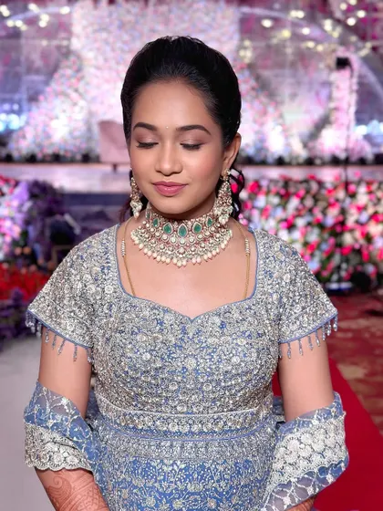 A modern and elegant look for the brother's big day, featuring a beautiful powder blue lehenga.