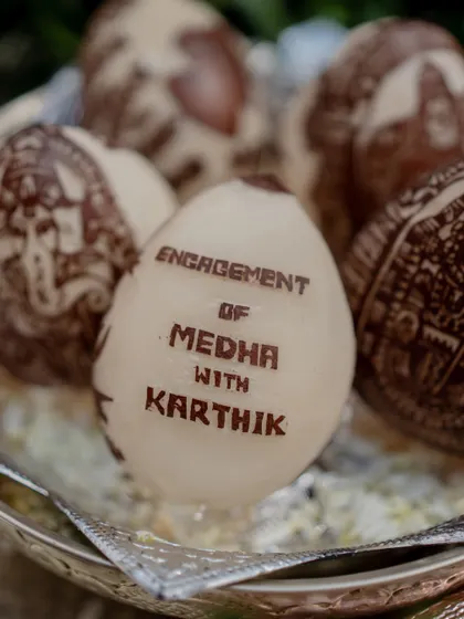 A unique and personal detail: coconuts carved with the couple's names and engagement announcement.