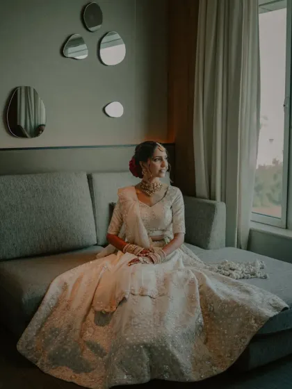 A colored version of the elegant bridal portrait, showing the beautiful details of her white lehenga.
