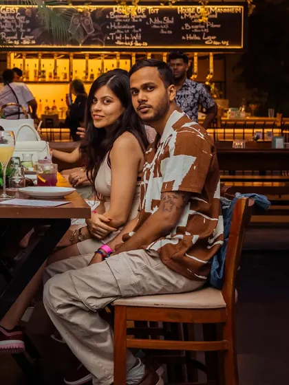 A couple enjoying their time at my crafthouse. My mansion is a place for connection, where you can share a meal and a moment away from the woes of the world.