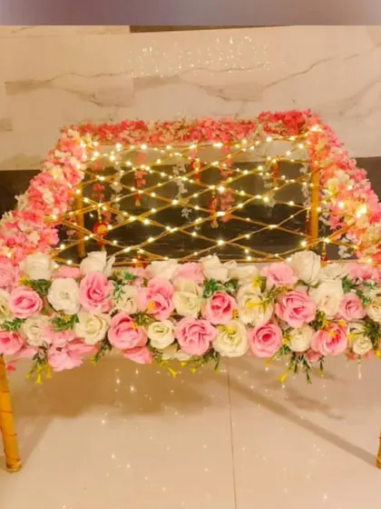 A beautifully decorated 'phoolon ki chaadar' for the bridal entry. This one is made with a canopy of pink and white roses and lit with fairy lights for a magical effect.