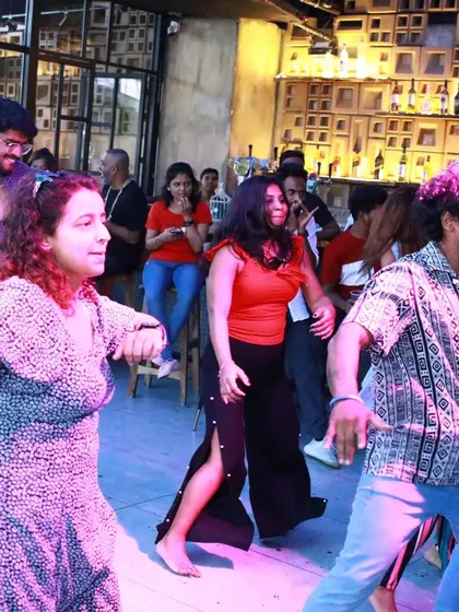 The vibrant energy of a Mixtape session in full swing. The colorful lighting and dynamic movement create a true party atmosphere.