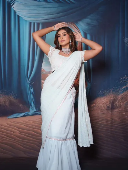 A full shot of the model in a modern, pre-draped saree, showing how my jewellery can elevate contemporary outfits.