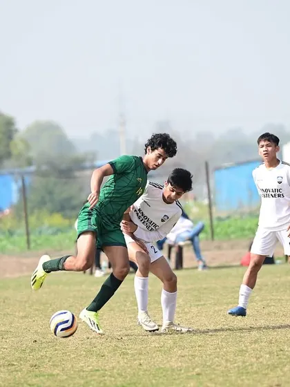 An action shot from the Dream Sports Championship semi-final, showing our player shielding the ball under pressure. This is the tenacity we build.