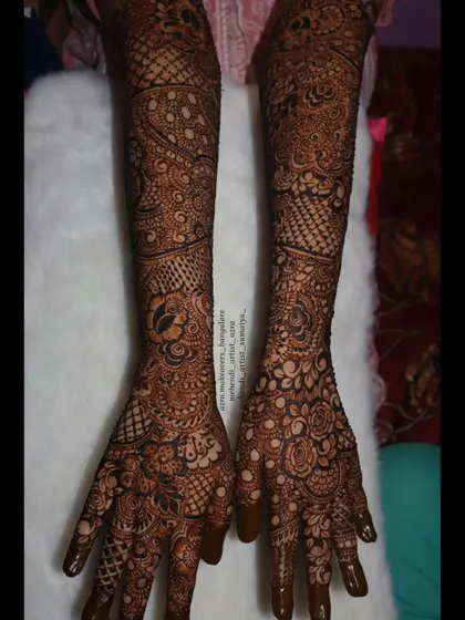 This full bridal set shows the complete design from palms to elbows, featuring a mix of traditional and contemporary elements.