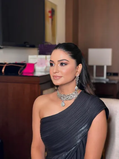 A sleek, wet-look ponytail for a cocktail night. This modern and high-fashion style is perfect for a one-shoulder gown.