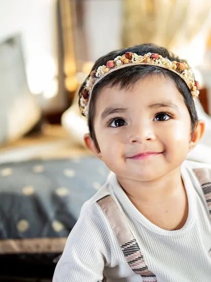 That sweet, knowing smile from a toddler is just heart-melting. These close-up portraits really let their adorable personality shine through.