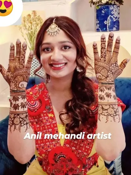 A smiling bride-to-be showing her lovely lotus-themed mehendi. The delicate patterns on her hands and forearms are perfect for any celebration.