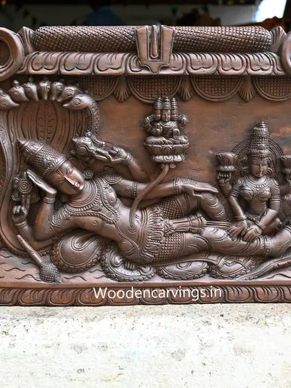 The central figures of the reclining Lord Vishnu and Goddess Lakshmi from the 48-inch Narayanar panel, showcasing the serene expressions and intricate details.